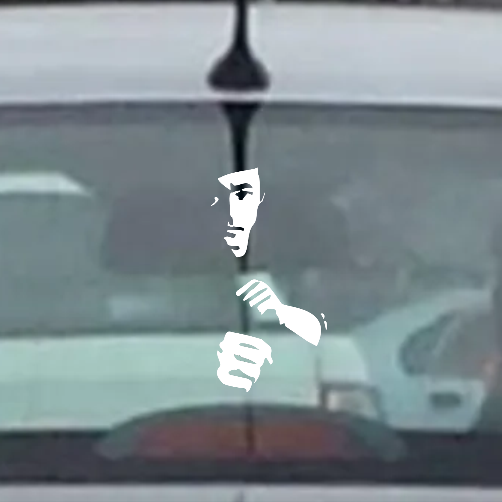 White silhouette of Bruce Lee on a car window