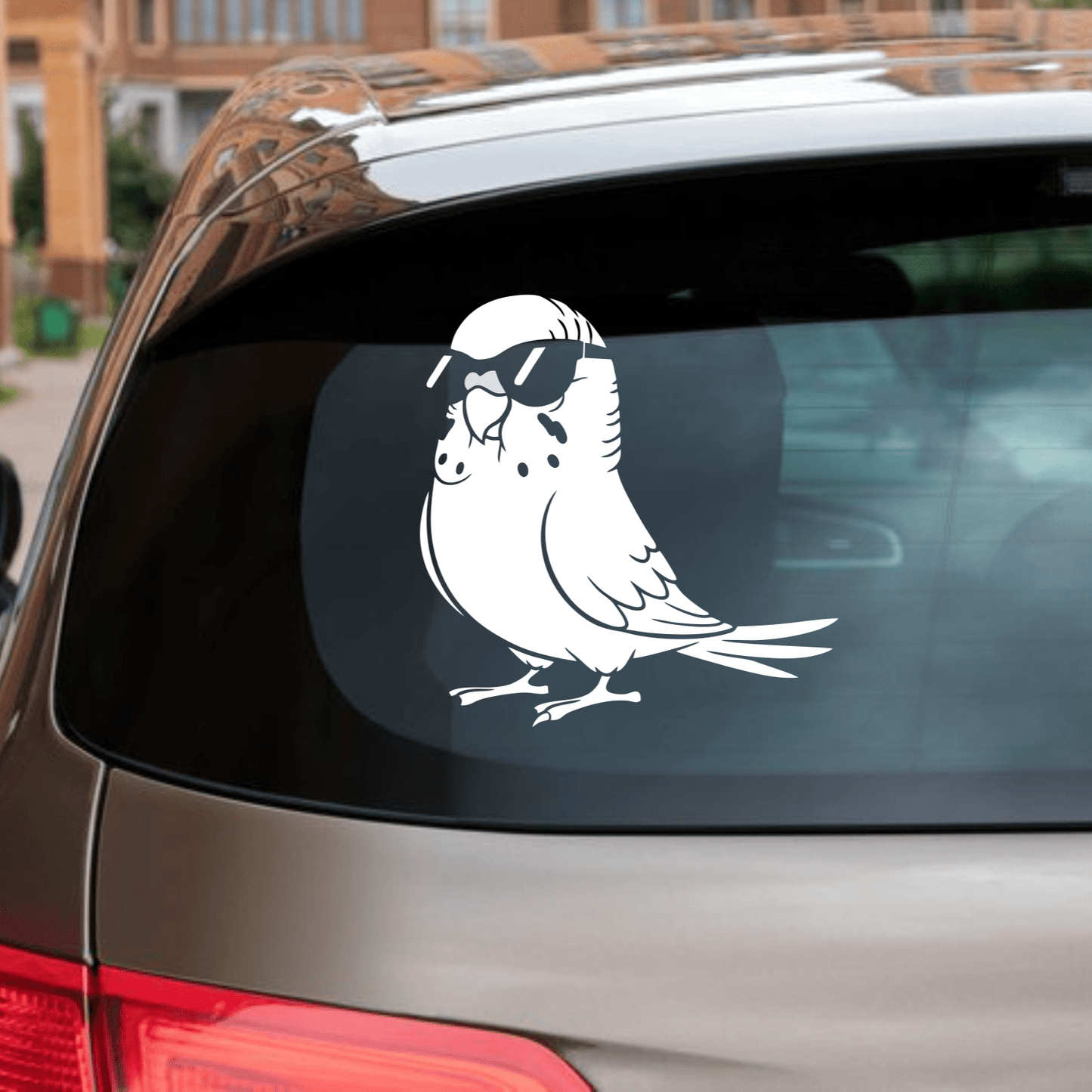 Car with a white bird decal on the back window