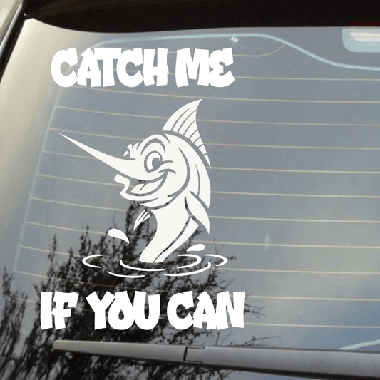 Car window with a humorous fishing decal and text 'Catch Me If You Can'.