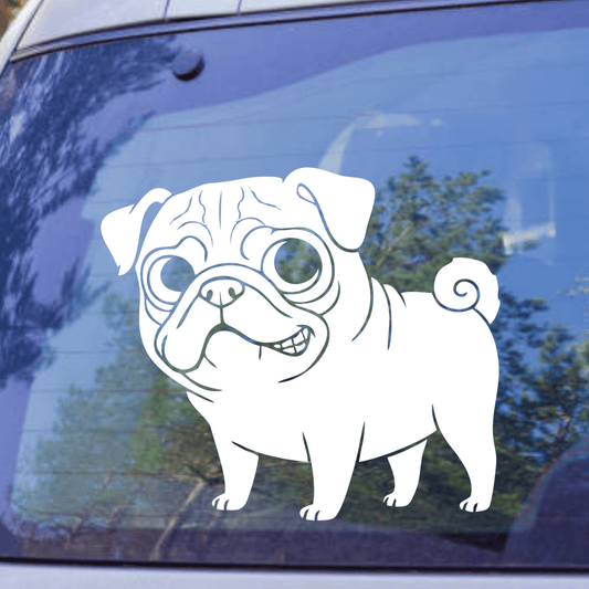 Cartoon pug decal on a car window with trees in the background