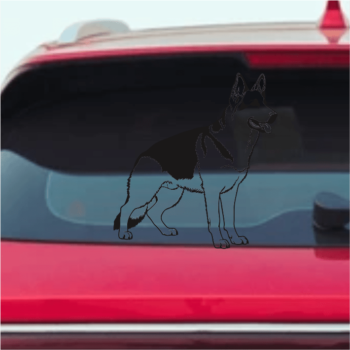 German Shepherd Dog decal on a car window with a clear sky background