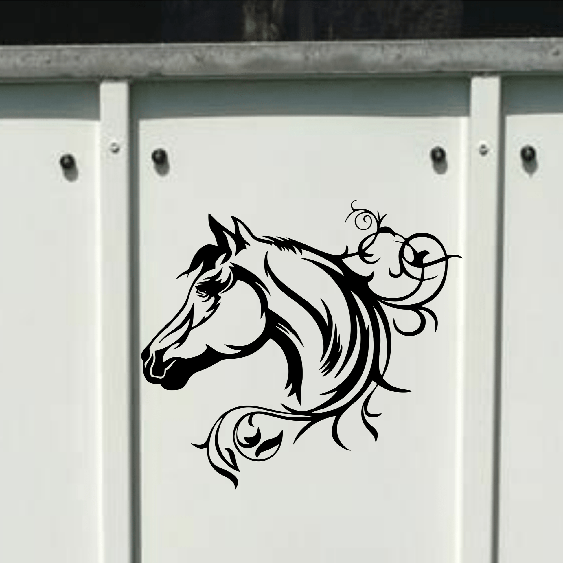 Decorative horse head design on a white surface with a metallic frame.