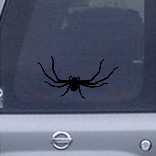 Black spider decal on a car window