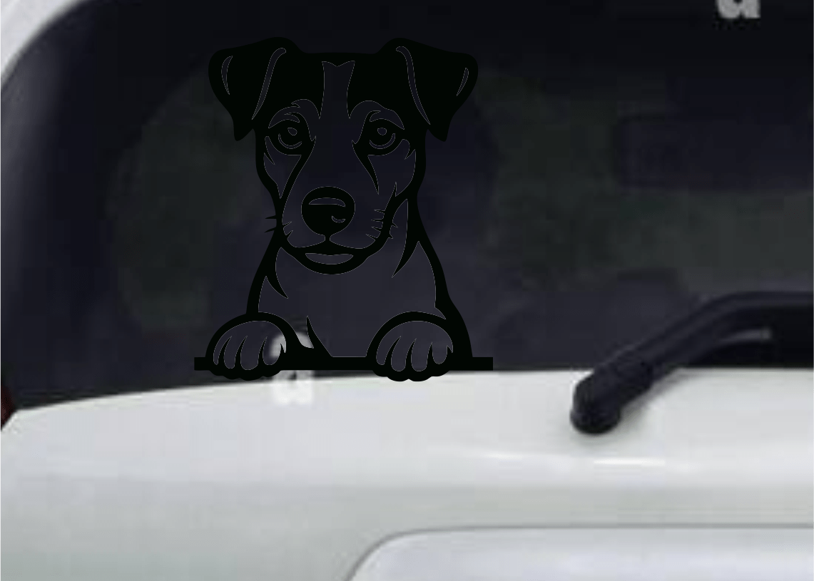 Car window with a Jack Russell dog decal on a white car