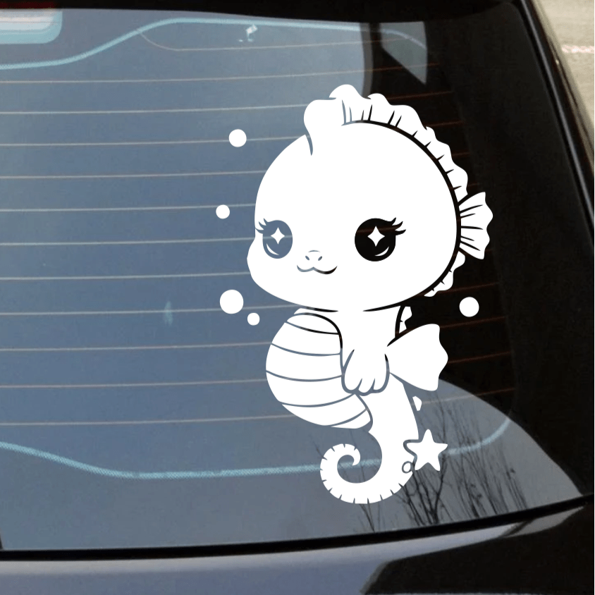 Car window with a cute white seahorse decal on a reflective surface.