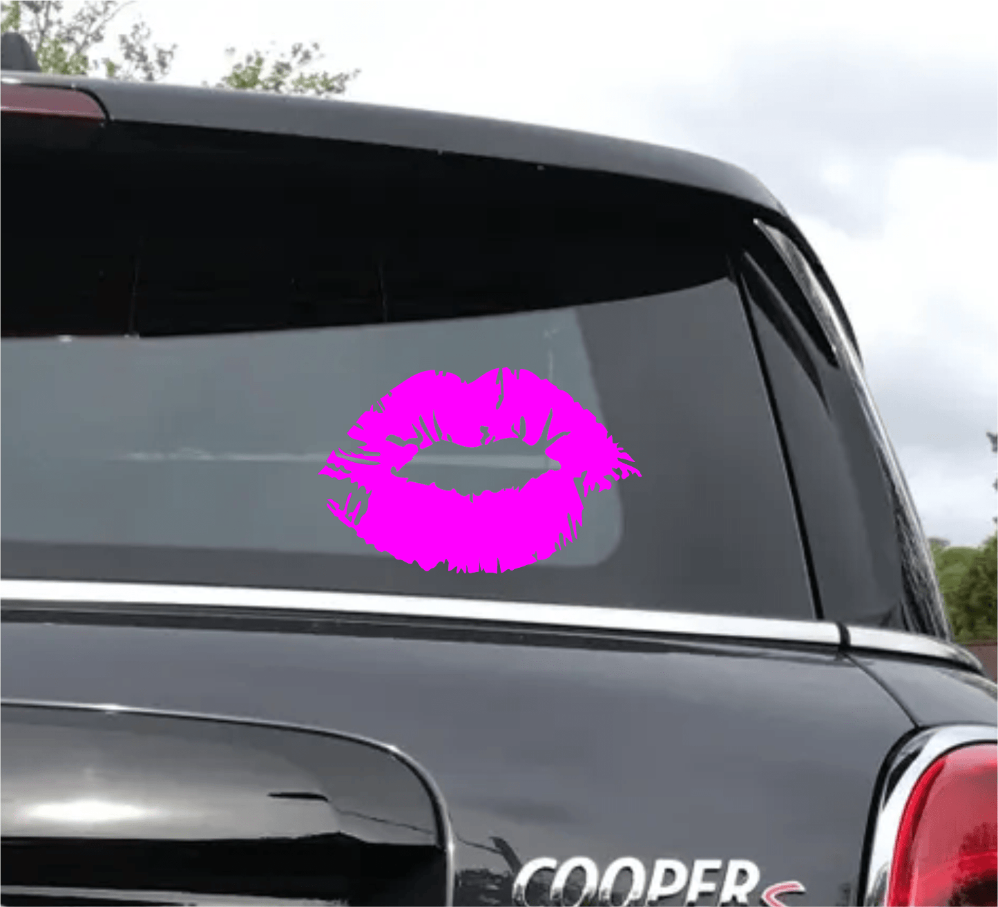 Pink lips decal on a car window with 'Cooper' branding.