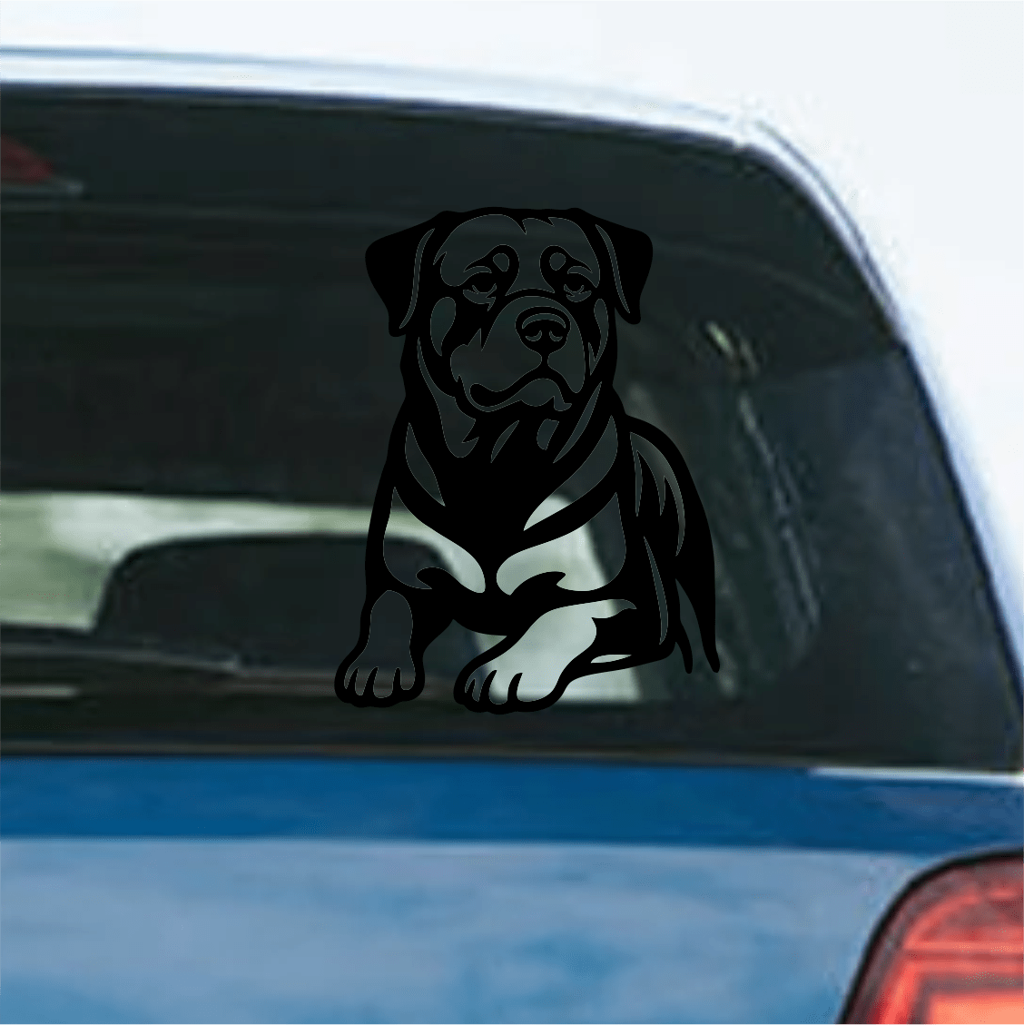 Black rottweiler decal on a car window