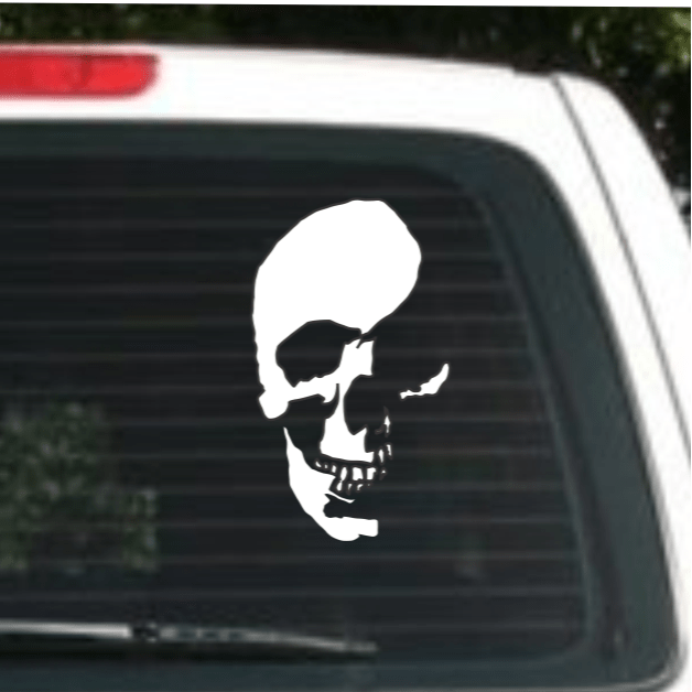 White skull decal on a car window