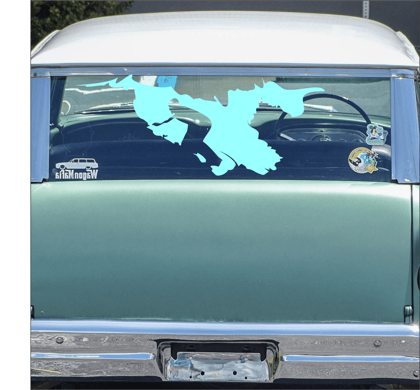 Car window with a blue decal of a surfer with visible stickers on a light blue car.