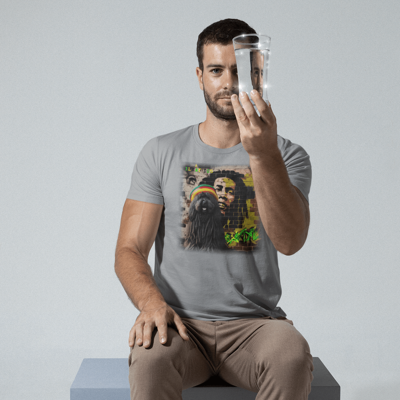 T-shirt featuring a Puli dog and Bob Marley, a reggae legend.