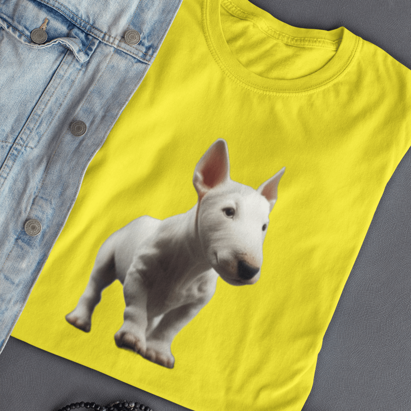 Graphic T-shirt featuring a playful Bull Terrier puppy, with a cute and endearing design that highlights the breed's youthful charm and distinctive features