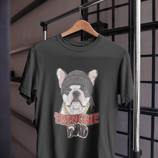 Black t-shirt with a graphic of a bulldog wearing a beanie and 'FRENCHIE DAD' text, hanging on a wooden hanger.