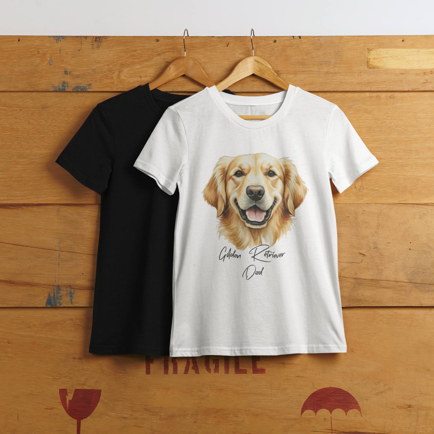 Black and white t-shirts with a Golden Retriever design on a wooden background