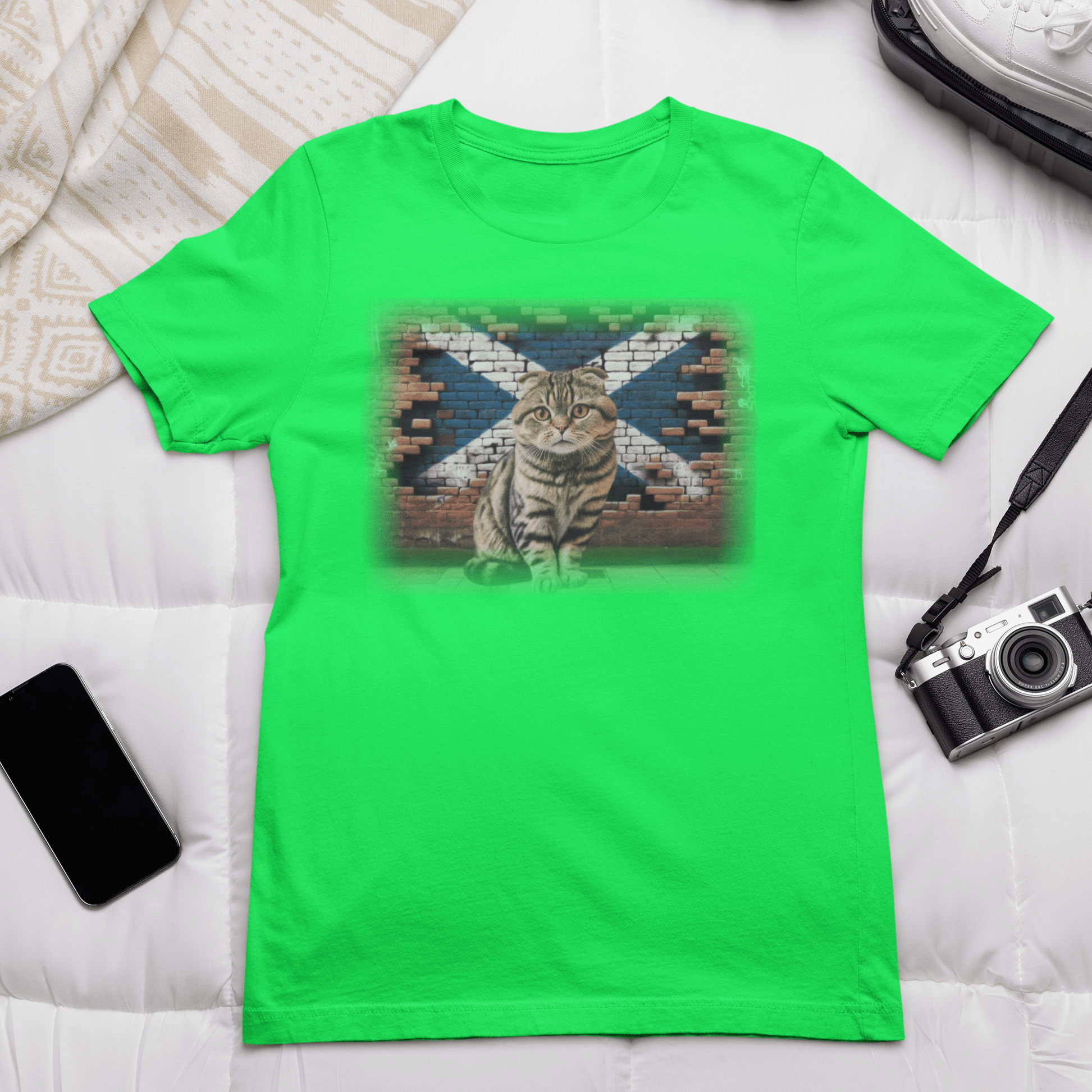 A Scottish Fold cat on a t-shirt, reminding you to "Shake it off" because it's too cute to resist.