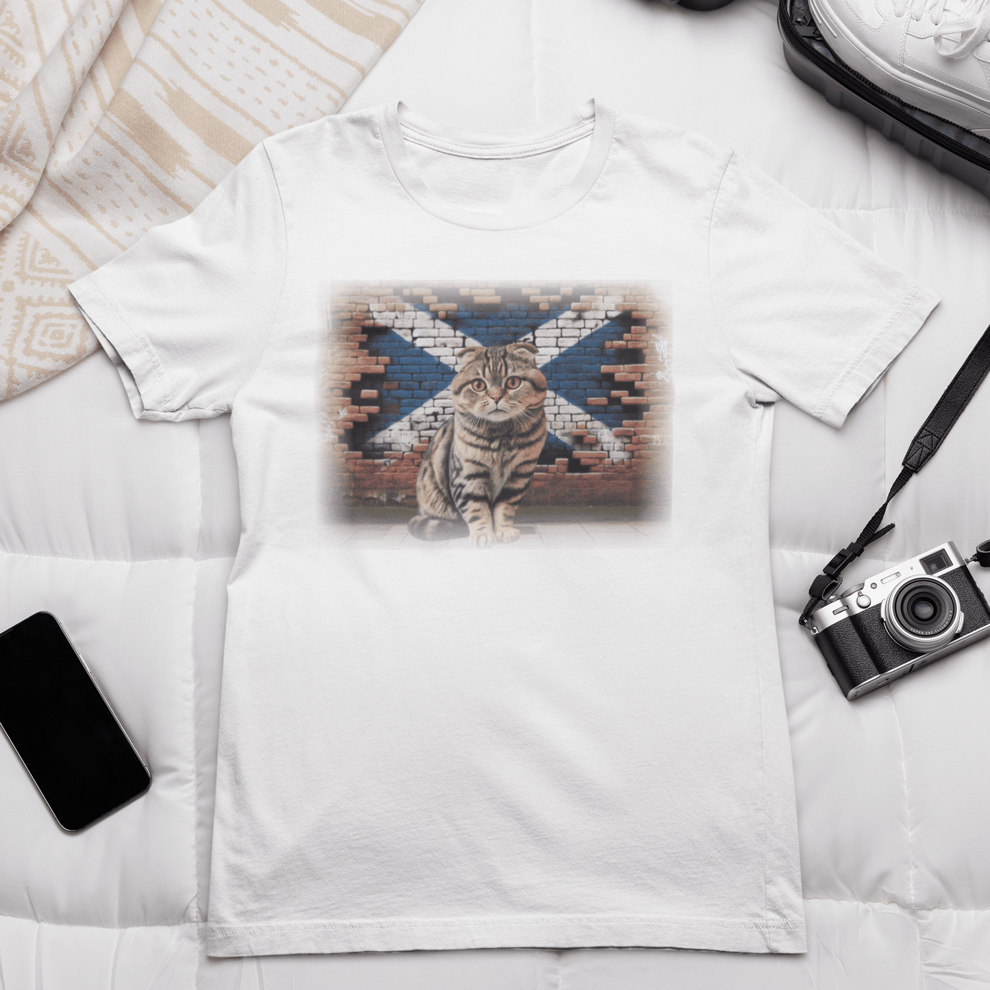 A Scottish Fold cat on a t-shirt, reminding you to "Shake it off" because it's too cute to resist.