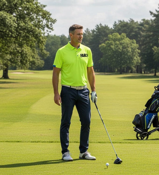 Man in a bright green shirt on a golf course with trees and a cloudy sky in the background.