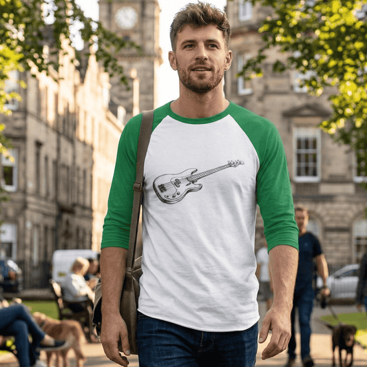 **A 3/4 sleeve raglan baseball tee featuring a white body and vibrant green sleeves. The center of the shirt displays a detailed black and white vintage-style pencil sketch of a classic electric bass guitar, angled diagonally. The shirt is shown on a plain white background.**