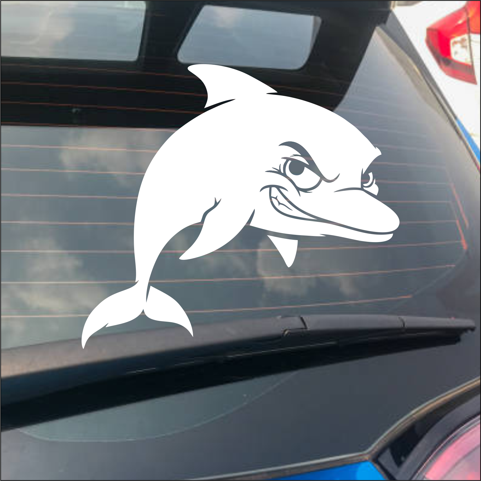 White dolphin decal on a car window