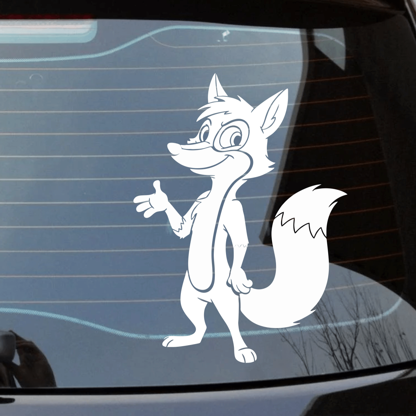Car window with a cartoon fox decal in an urban setting