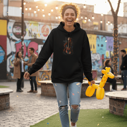 Woman walking outdoors with a bass guitar hoodie, colorful graffiti in the background