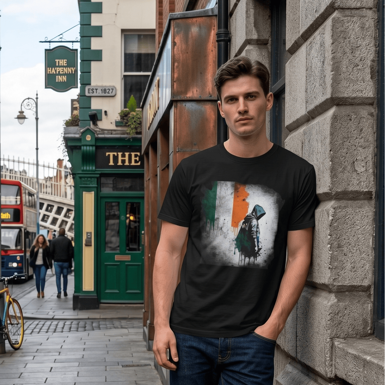Man wearing a black t-shirt with a graphic design on a street in an urban setting