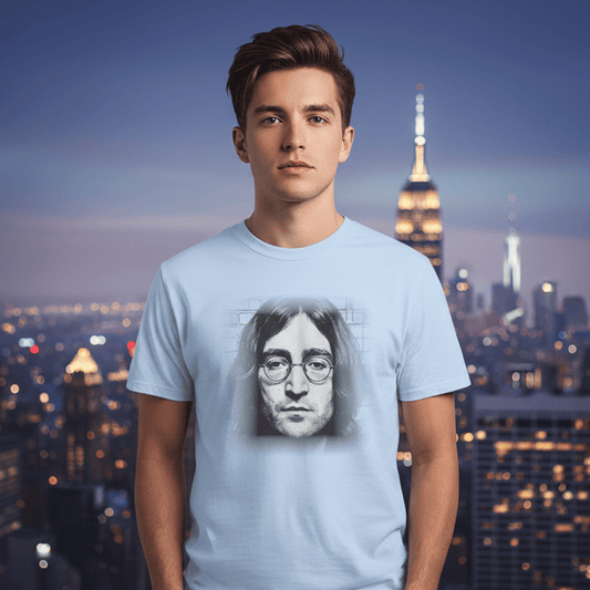 Person wearing a t-shirt with a graphic of a famous person against a city skyline at night.
