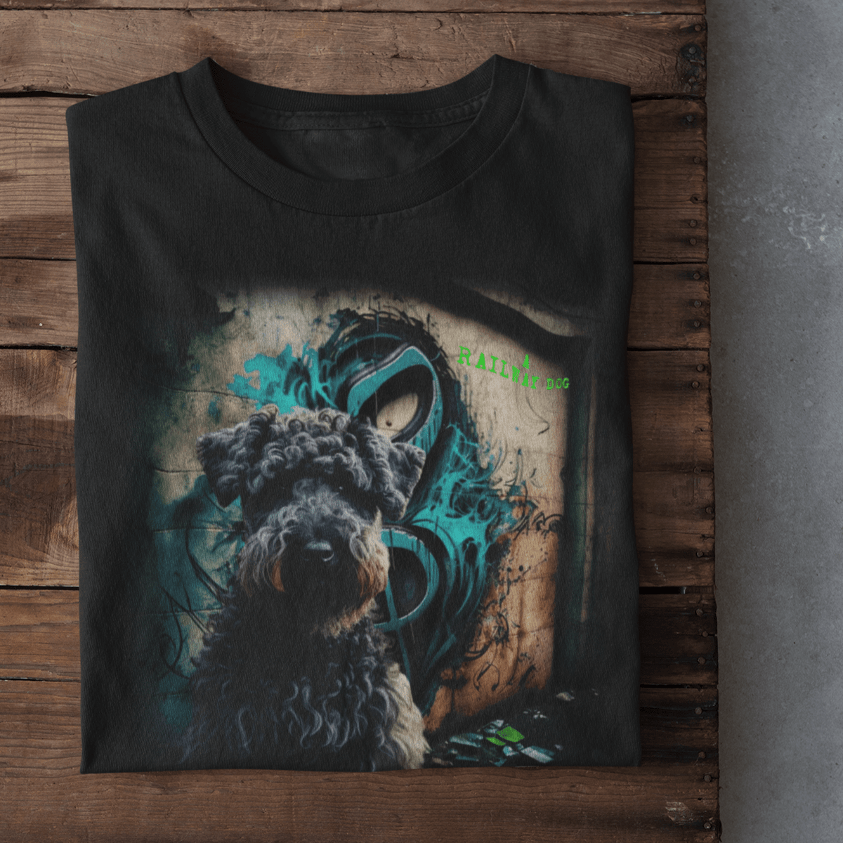 graphic t-shirt featuring a curly-coated Kerry Blue Terrier in front of teal urban graffiti art with green "A Railway Dog" text