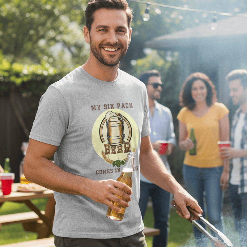 Man grilling sausages at a barbecue wearing a My Beer Comes In a Keg Tee with friends in the background