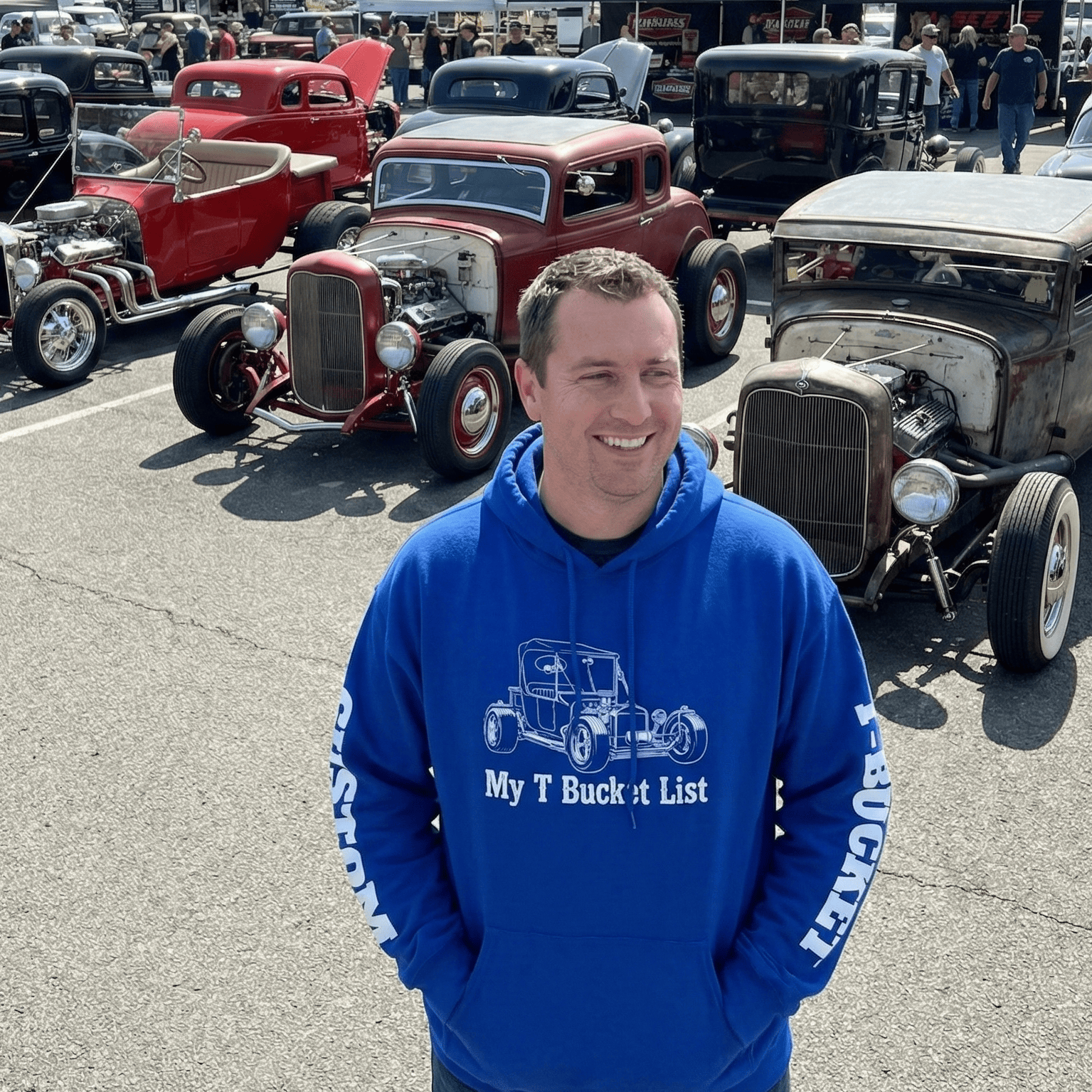 Royal blue hoodie featuring a white line drawing of a T-Bucket hot rod on the chest and "CUSTOM" printed in white text down the sleeve.