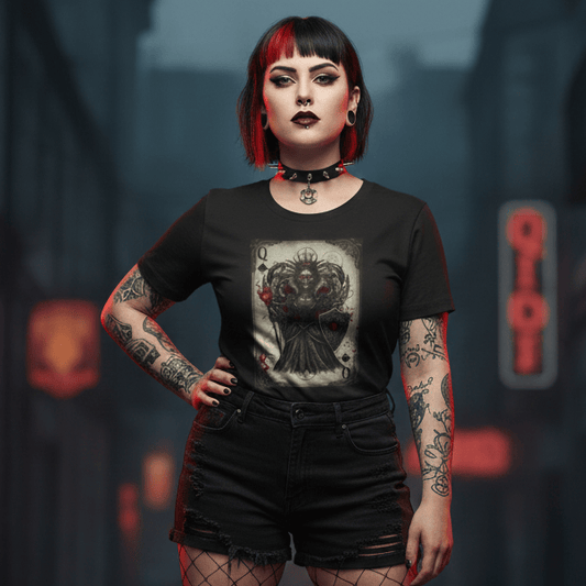 Woman in a dark, urban setting wearing a black Queen of Hearts t-shirt with a graphic design.