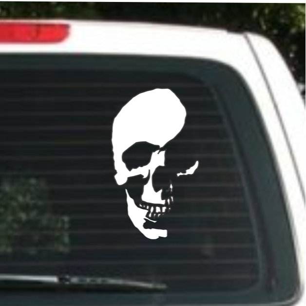White skull decal on a car window