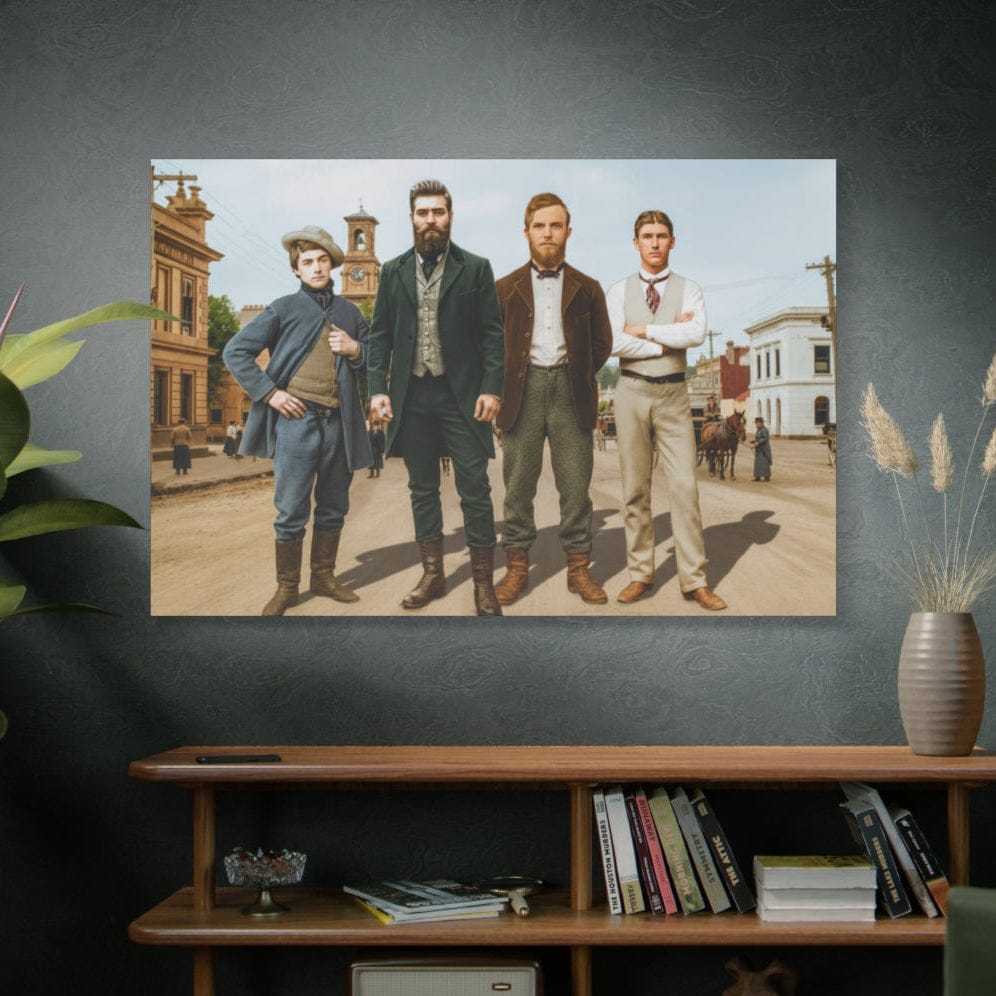 A high-resolution, colorized historical reconstruction of the Kelly Gang standing on a dirt street in colonial Jerilderie, 1879. The four men—Ned Kelly, Dan Kelly, Steve Hart, and Joe Byrne—are dressed in authentic 19th-century attire, including waistcoats, heavy overcoats, and boots. In the background, period-accurate brick buildings, a clock tower, and a horse-drawn carriage under a clear sky recreate the atmosphere of frontier Australia.