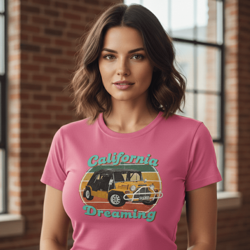 Woman wearing a pink t-shirt with 'California Dreaming' graphic design.
