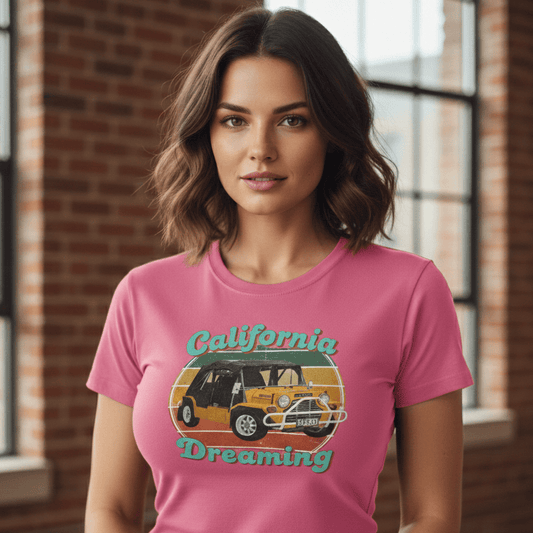 Woman wearing a pink t-shirt with 'California Dreaming' graphic design.