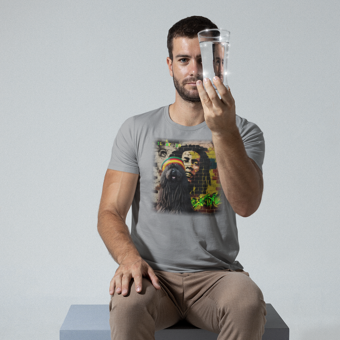 T-shirt featuring a Puli dog and Bob Marley, a reggae legend.