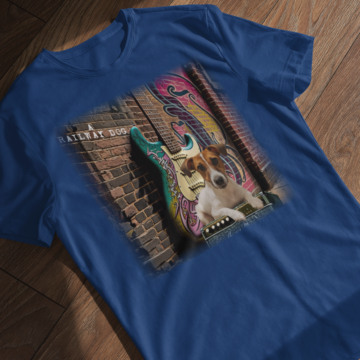 This t-shirt combines a Jack Russell Terrier dog with a classic Fender Stratocaster electric guitar in a graphic image.