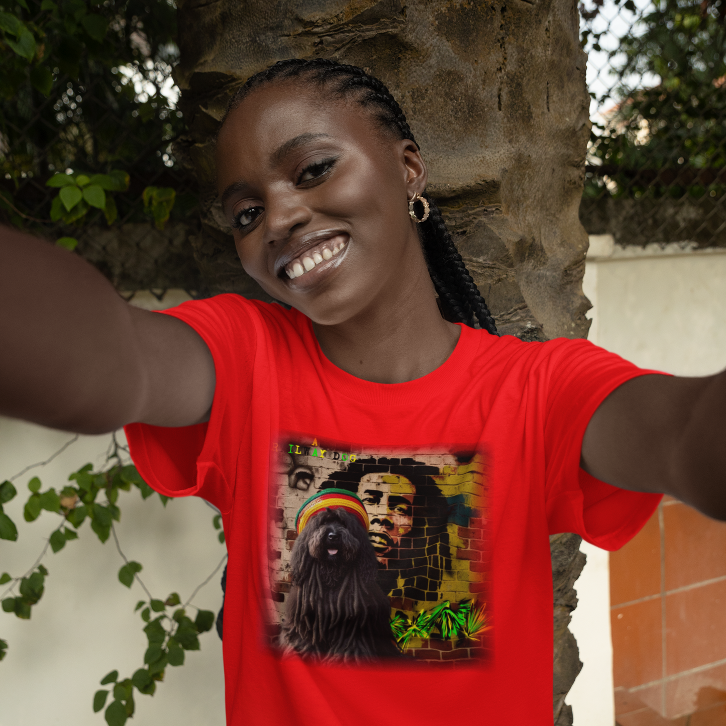 T-shirt featuring a Puli dog and Bob Marley, a reggae legend.