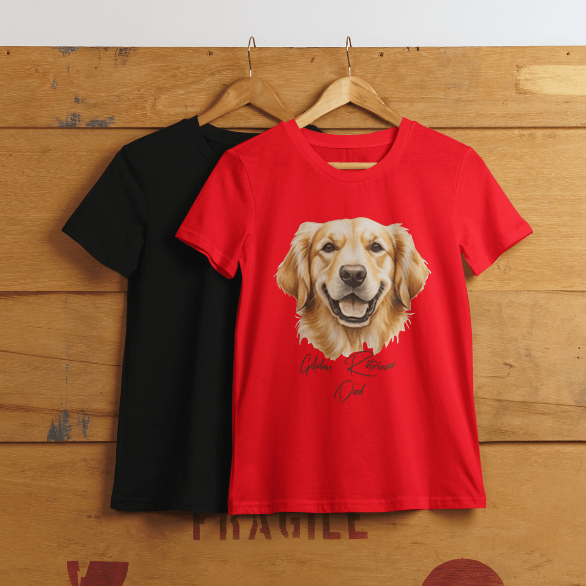 Black and red t-shirts with Golden Retriever Dad graphic on a wooden background