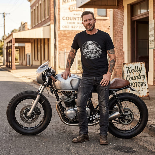 Man wearing vintage Ned Kelly iron helmet graphic t-shirt standing outdoors