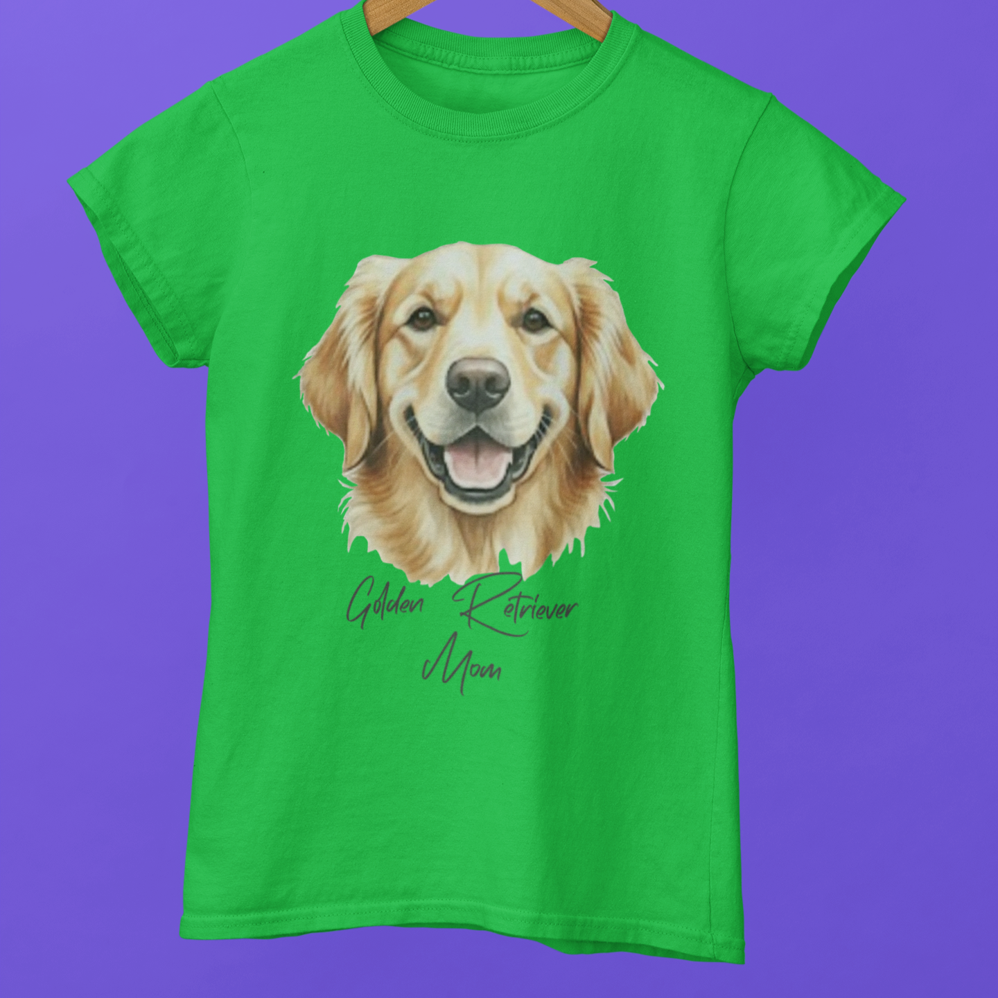 Green t-shirt with a Golden Retriever illustration on a hanger against a purple background