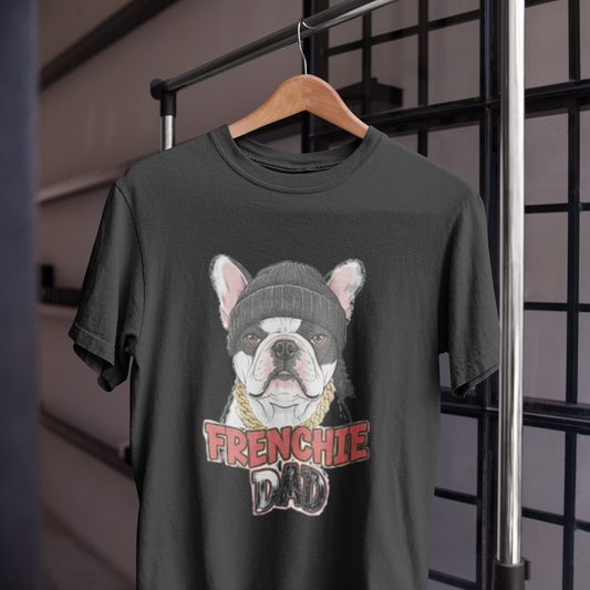 Black t-shirt with a graphic of a bulldog wearing a beanie and 'FRENCHIE DAD' text, hanging on a wooden hanger.