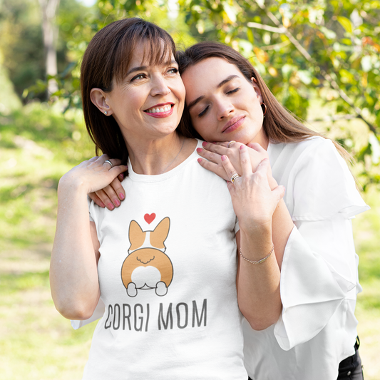 Two women standing outdoors with one wearing a 'Corgi Mom' t-shirt.