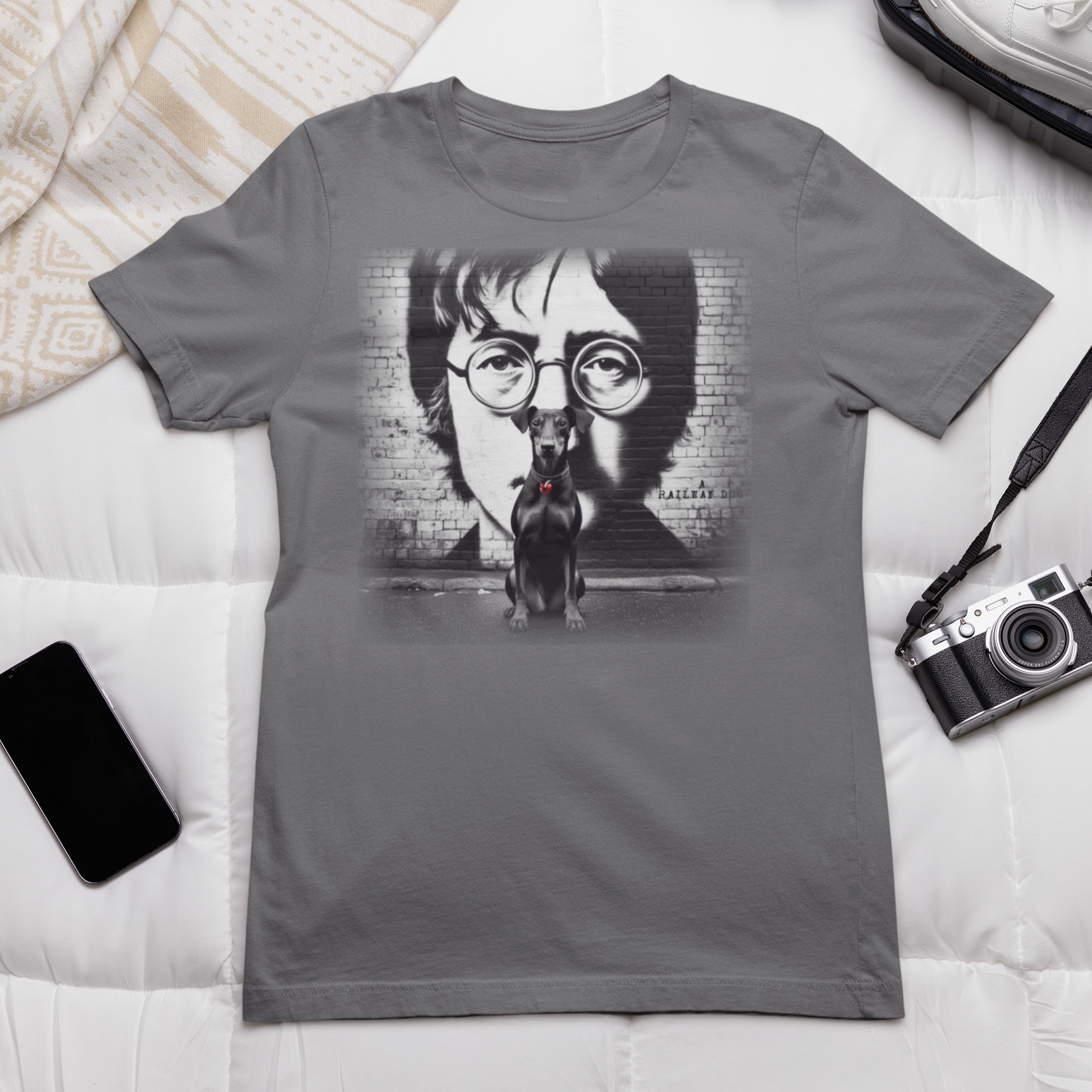 Graphic T-shirt featuring a Manchester Terrier in tribute to John Lennon, with a stylish and artistic design inspired by the iconic musician.