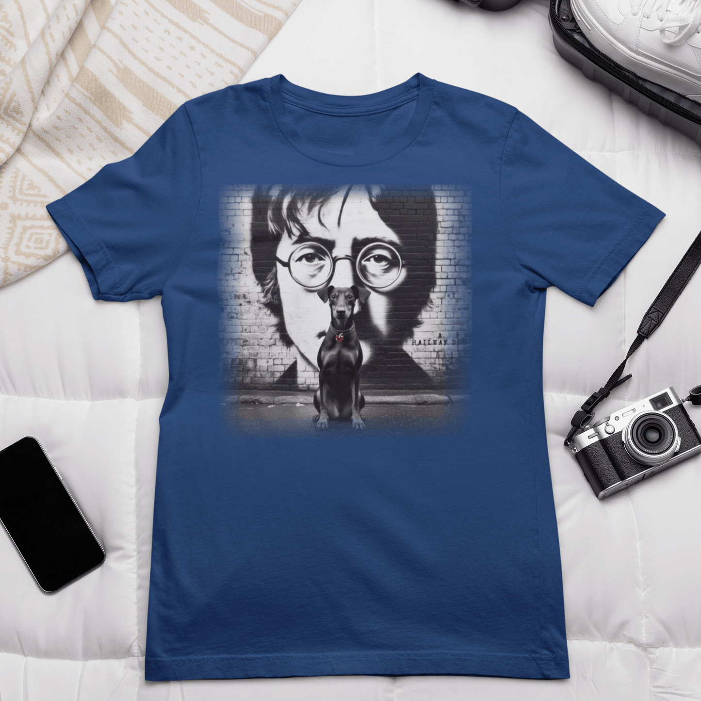 Graphic T-shirt featuring a Manchester Terrier in tribute to John Lennon, with a stylish and artistic design inspired by the iconic musician.