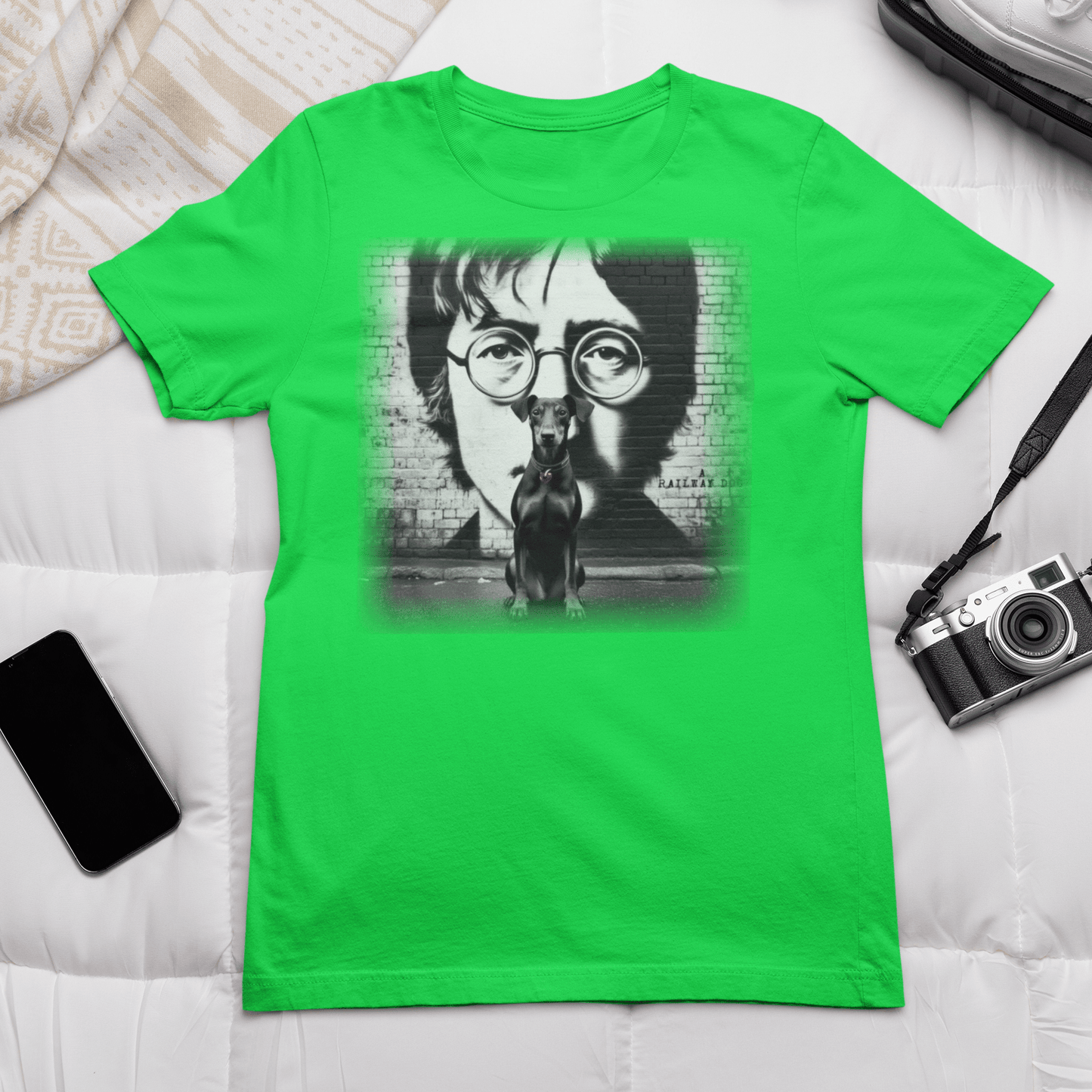 Graphic T-shirt featuring a Manchester Terrier in tribute to John Lennon, with a stylish and artistic design inspired by the iconic musician.