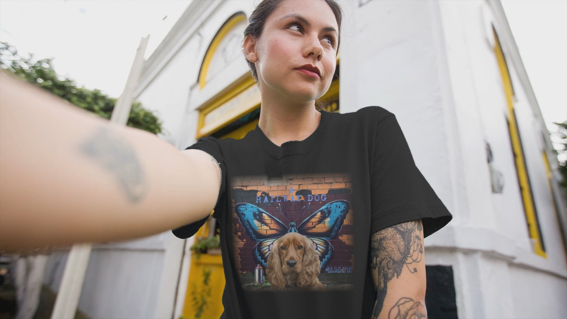 A t-shirt with a graphic design featuring a Cocker Spaniel dog and a butterfly